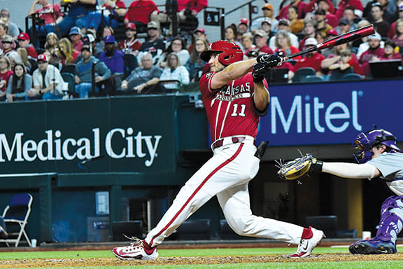 Jared Wegner blasts a shot to deep left center for a home run in the first inning against TCU at Globe Life Field.